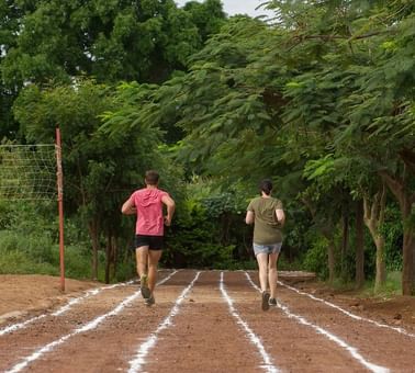 A Couple jogging on a track near Lake Manyara Serena Lodge