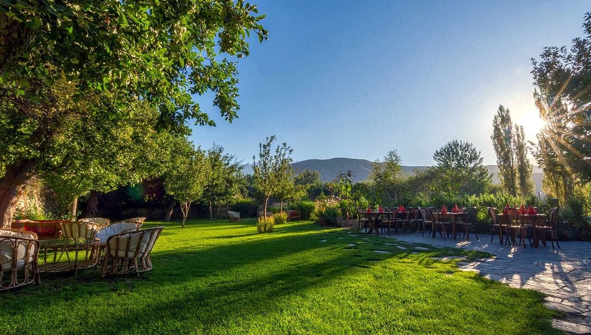 An Outdoor Lounge area in a garden at Serena Khaplu Palace