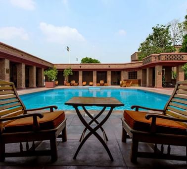 Lounge area by the hotel pool at Faisalabad Serena Hotel